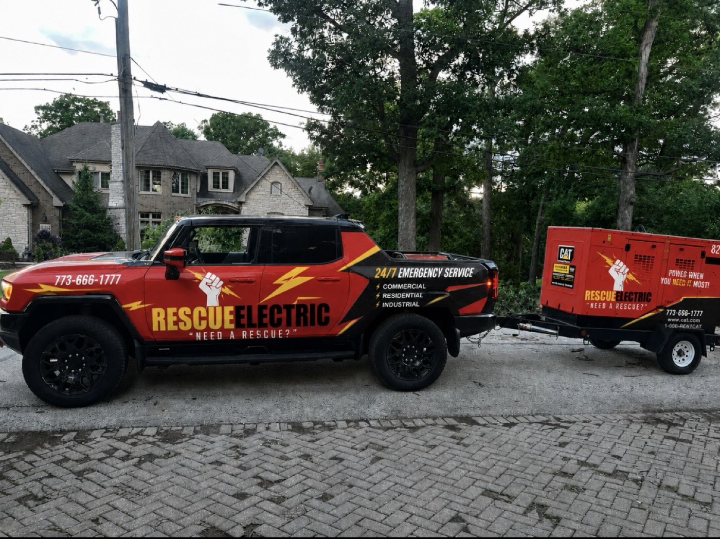 Rescue Electric 24/7 emergency truck towing a CAT generator trailer